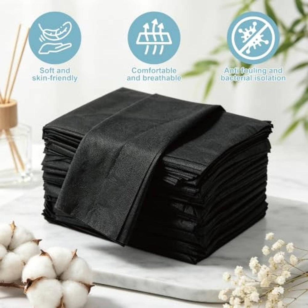 Black disposable table sheets, non-woven material, folded stack with top sheet