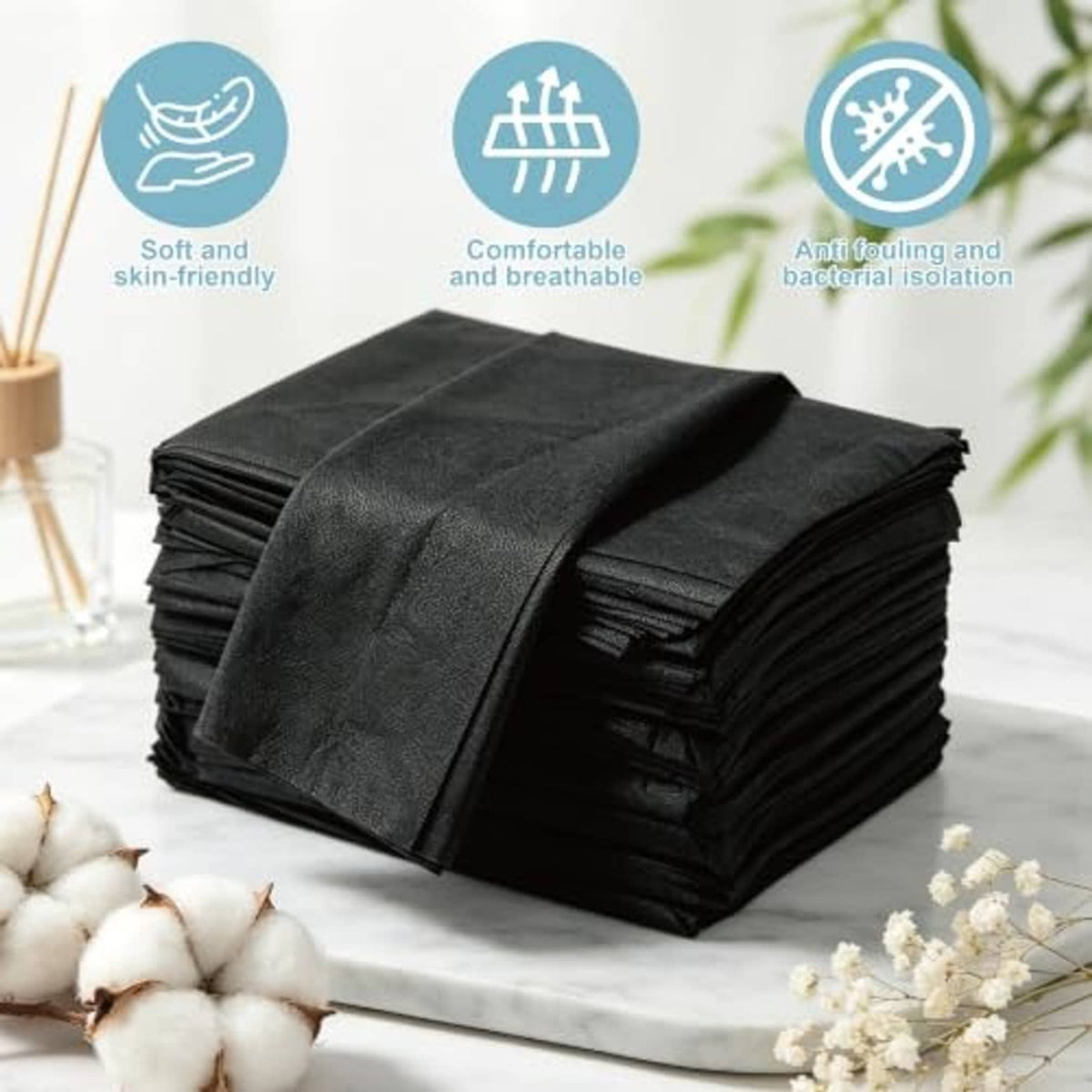 Black disposable table sheets, non-woven material, folded stack with top sheet