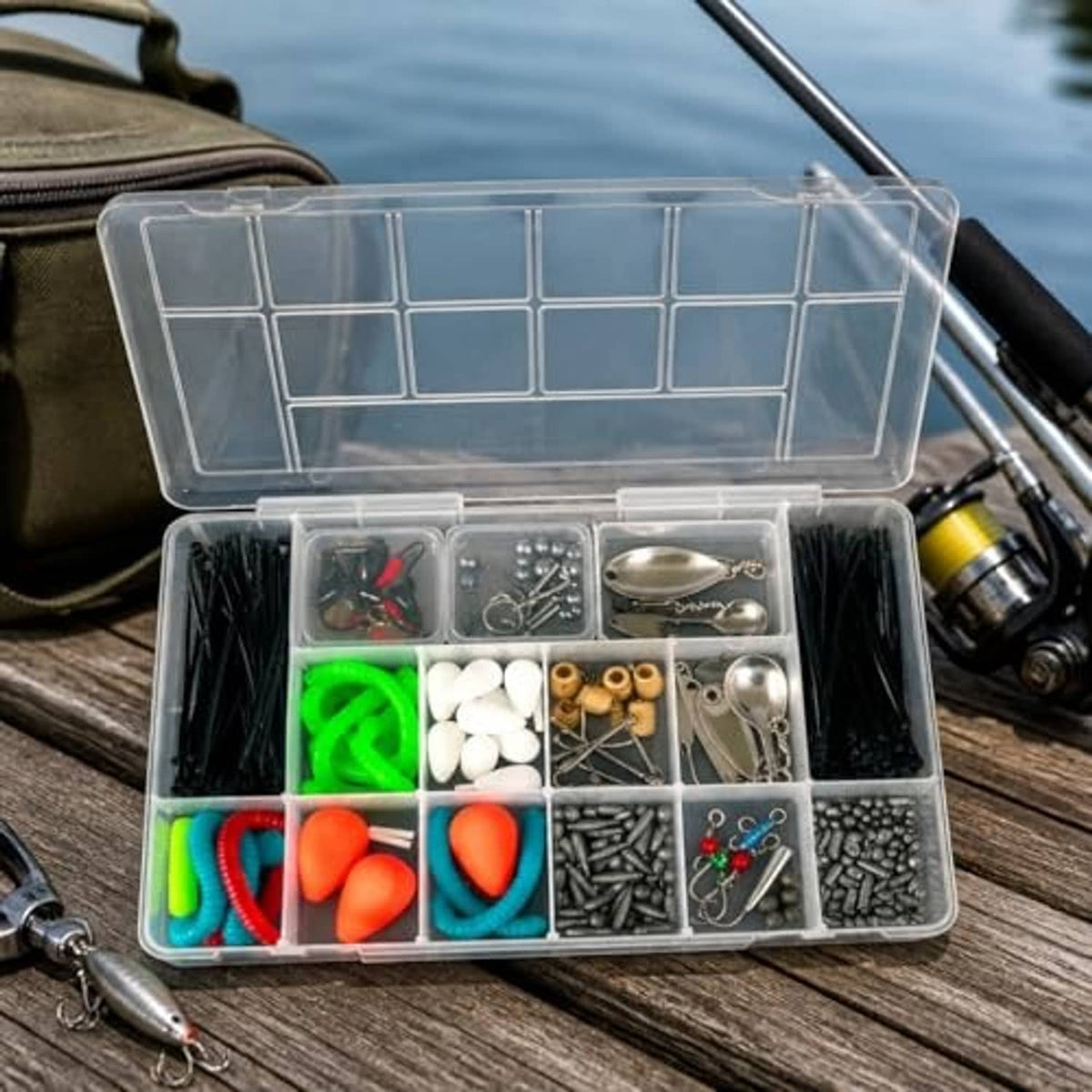 Clear tackle box organizer with hinged lid and 13 compartments on a wooden surface
