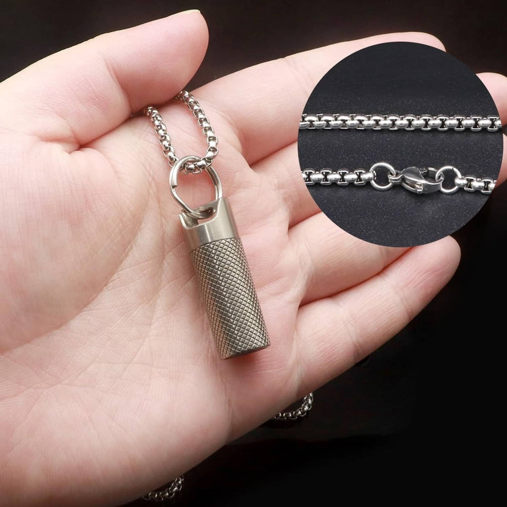 Titanium pill fob necklace pendant with textured cylinder capsule shown on open hand
