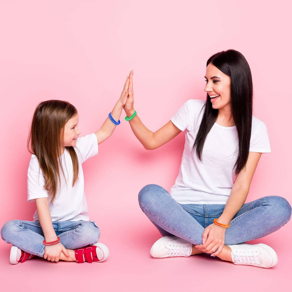 Silicone wristbands with “Jesus Loves You” print on mother and child