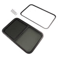 RV horizontal slider window with dark trim ring and tinted two-panel glass screen
