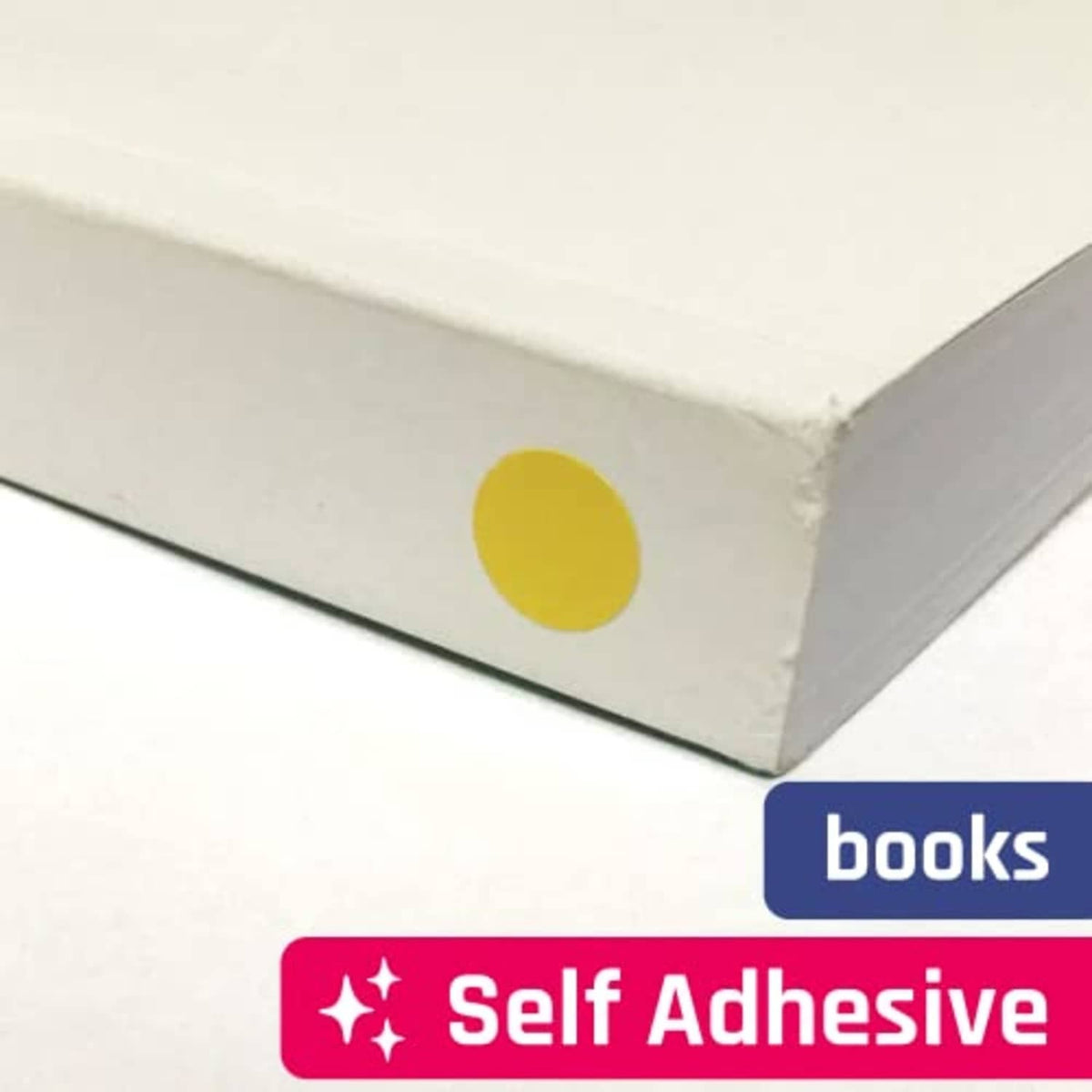 Self-adhesive yellow round dot sticker applied on a book cover surface