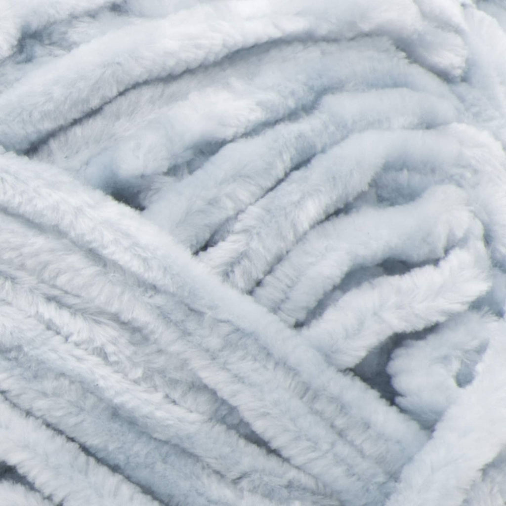 Close-up of light blue, plush looped yarn texture
