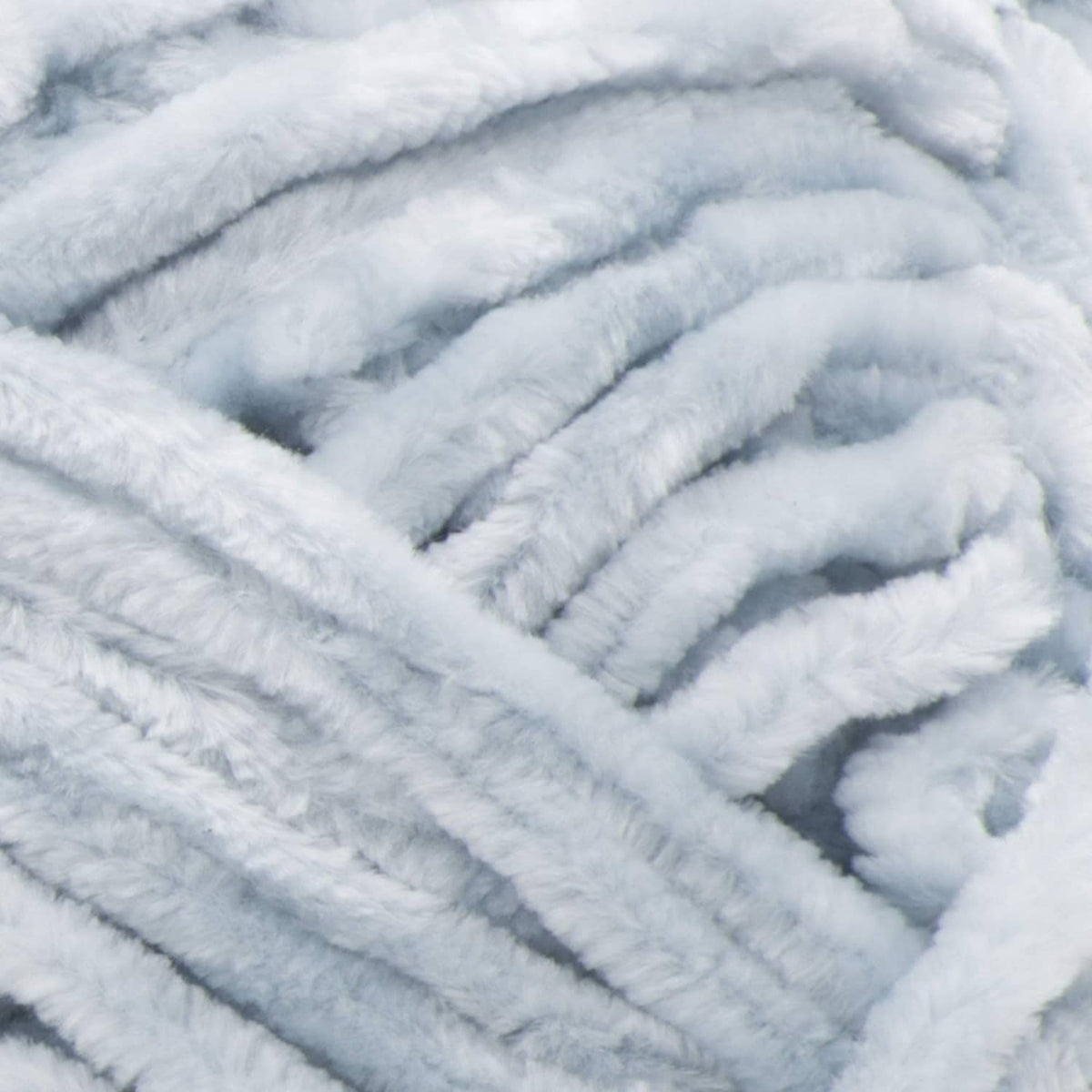 Close-up of light blue, plush looped yarn texture