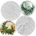 Circular silicone molds with embossed leaves, pine needles, and berry details