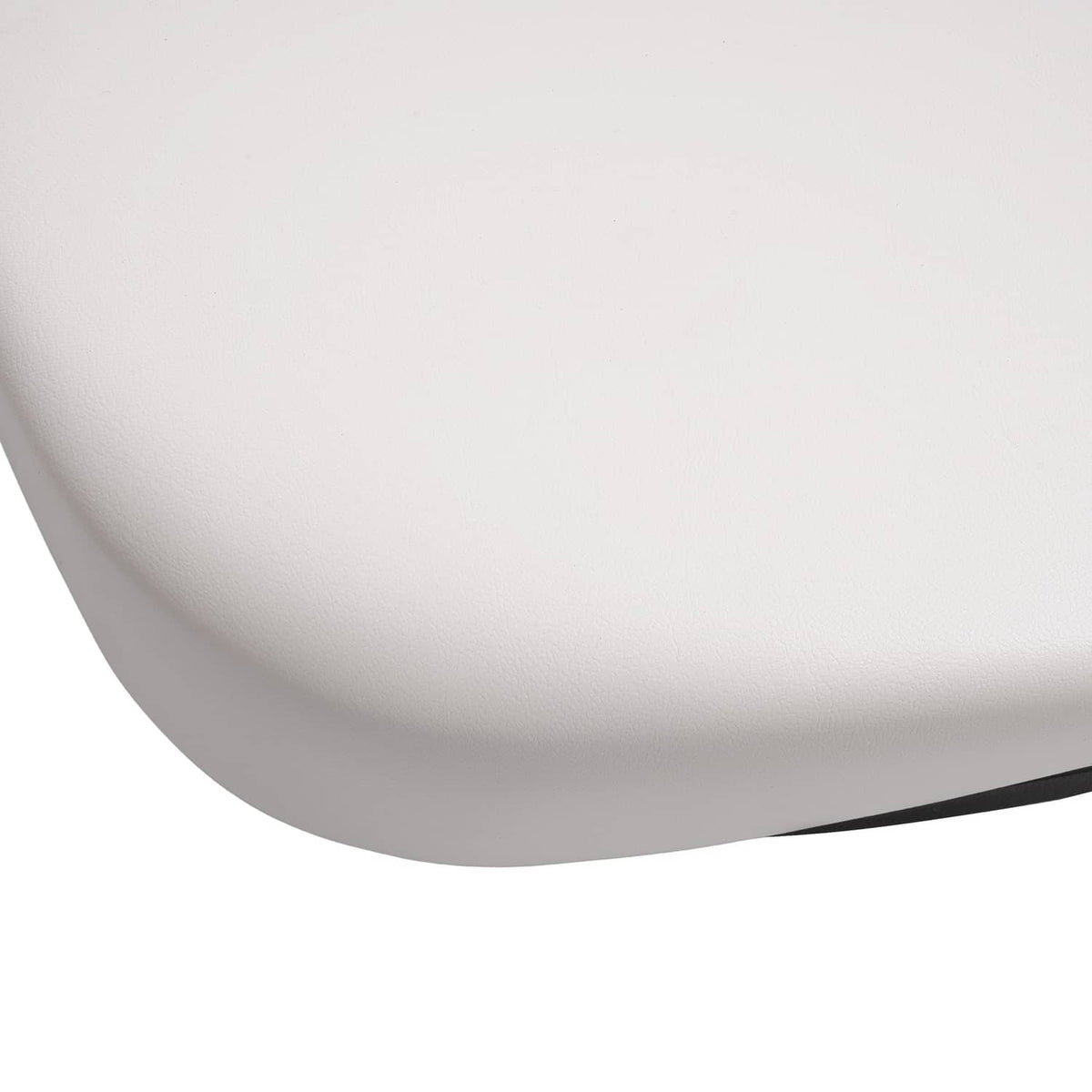 Close-up of white seat backrest cushion surface with black outer edge