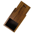 Small wooden gift box with sliding lid, open, dark interior compartment