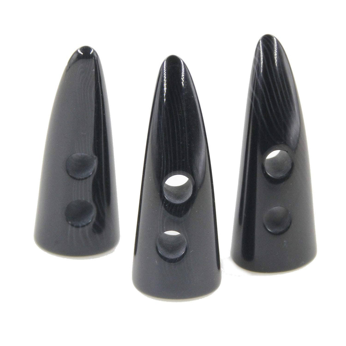 Black resin horn-shaped toggle buttons with two holes, close-up