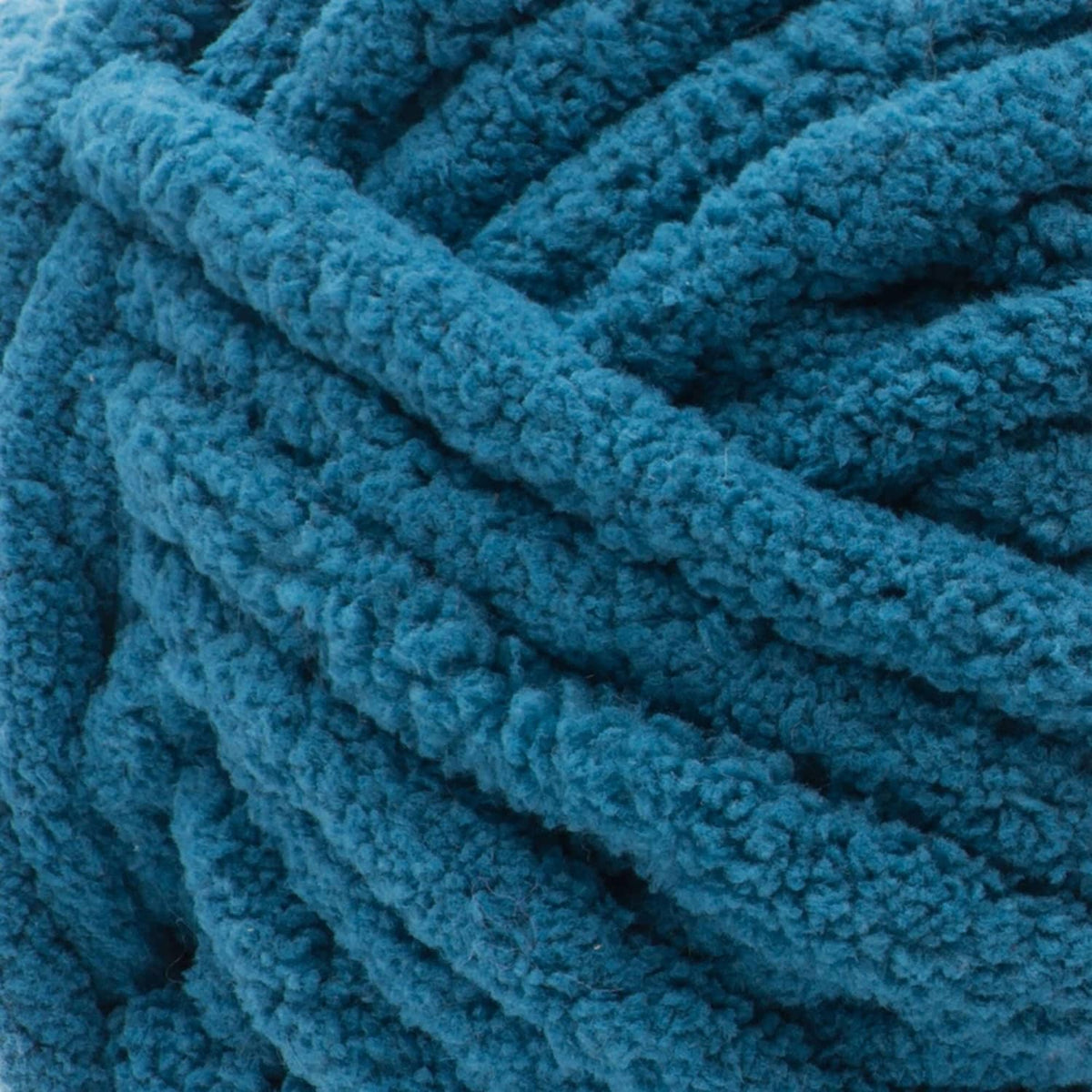 Close-up of teal-blue chenille-style yarn texture with thick raised loops