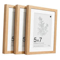 Set of three solid oak 5x7 picture frames with real glass and white matting