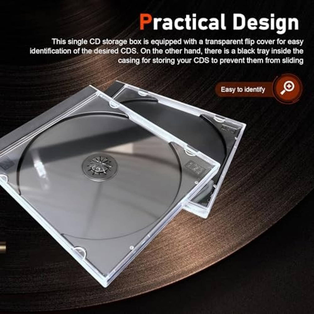 Clear CD jewel case lying open, showing black disc tray and snap-closed lid
