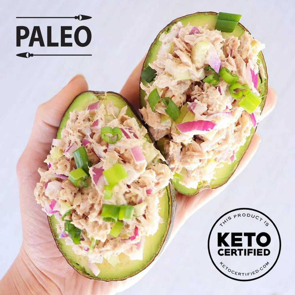 Tuna salad in avocado halves with sliced green onion, keto certified badge