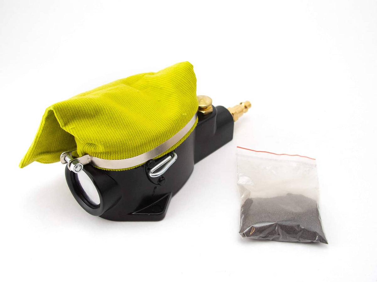 Pneumatic air spark plug cleaner tool with black body and lime cloth sandbag