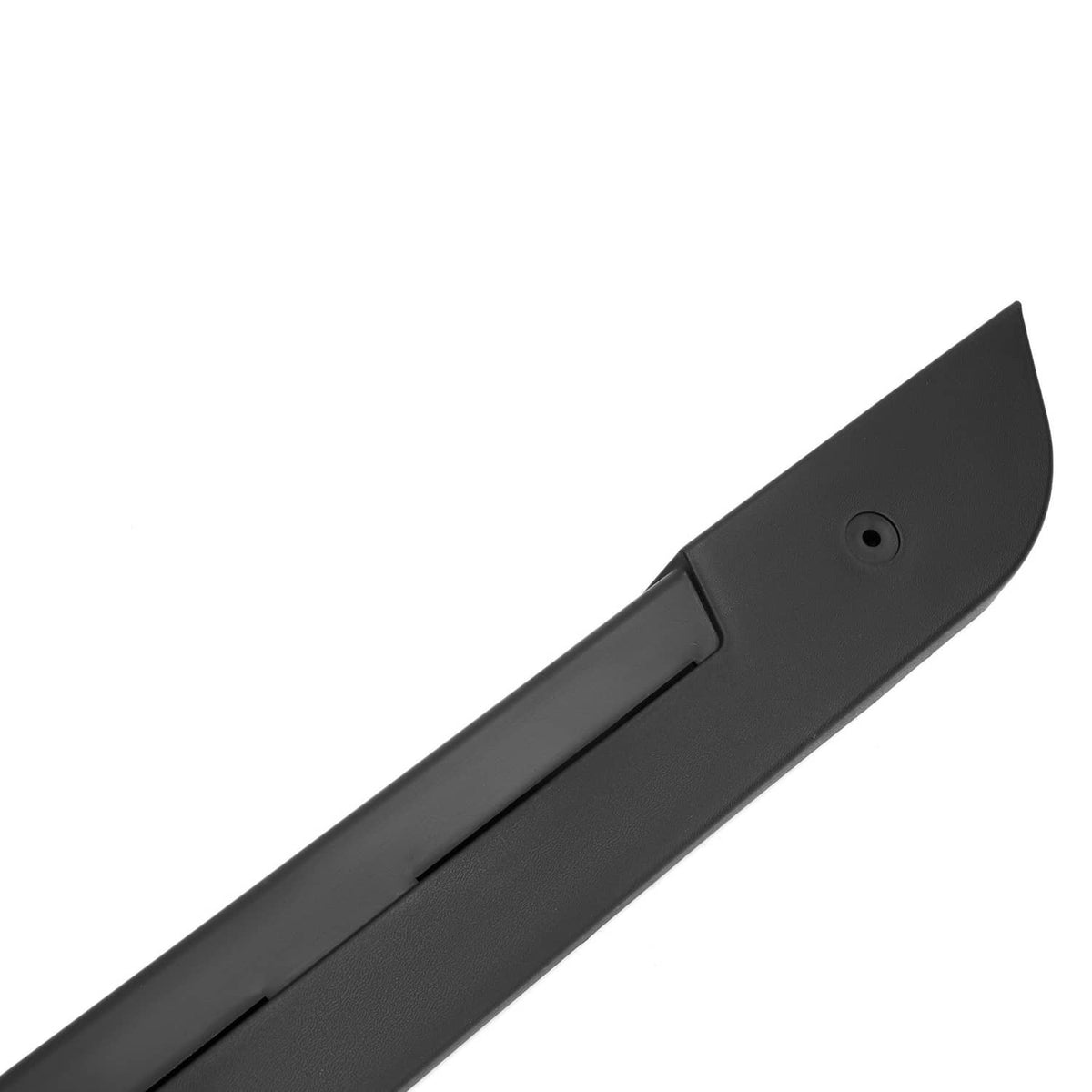Close-up of black rocker panel end with mounting hole and seam line.