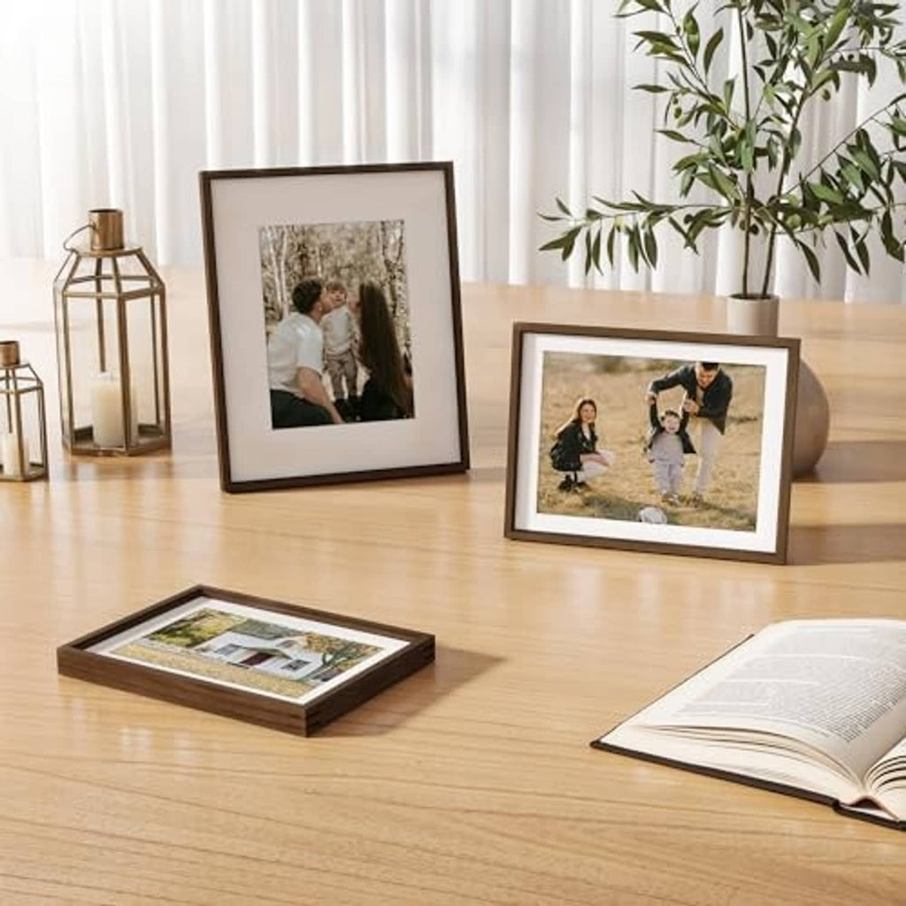Walnut 6x8 picture frames on a wooden table, with matted photo displays