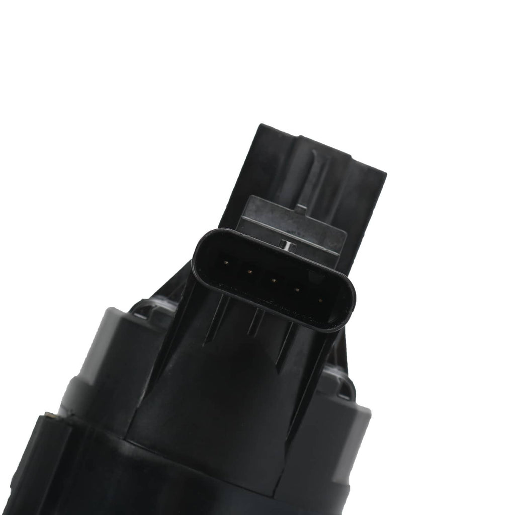 Black electrical connector and sensor plug on turbocharger housing.
