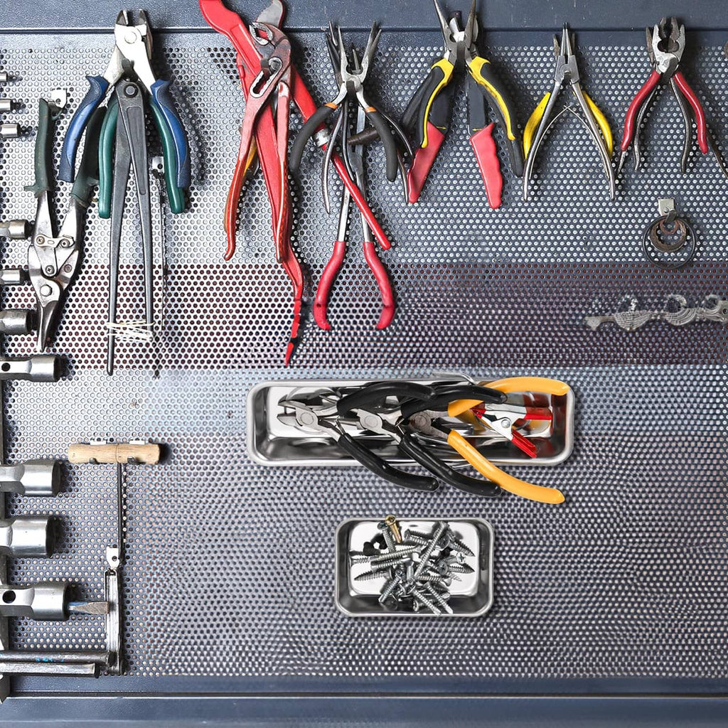 Stainless steel magnetic parts trays holding assorted screws and small fasteners