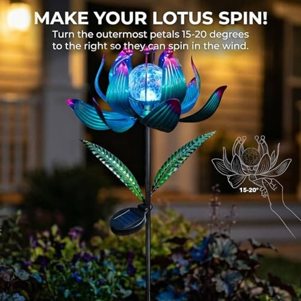 Solar wind spinner lotus with blue petals and glowing crackle-glass globe on tall black pole
