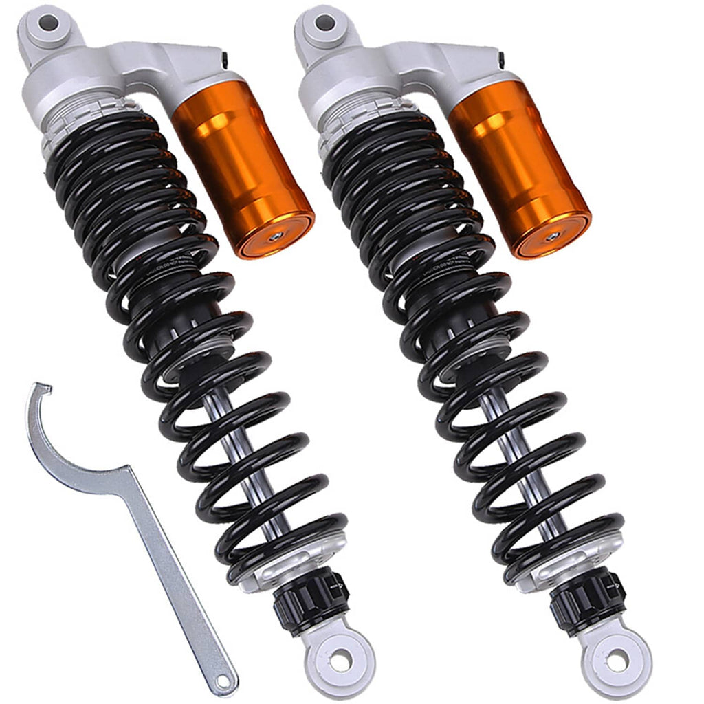 Pair of front shock absorbers with black coil springs, orange-gold reservoirs, silver brackets; wrench