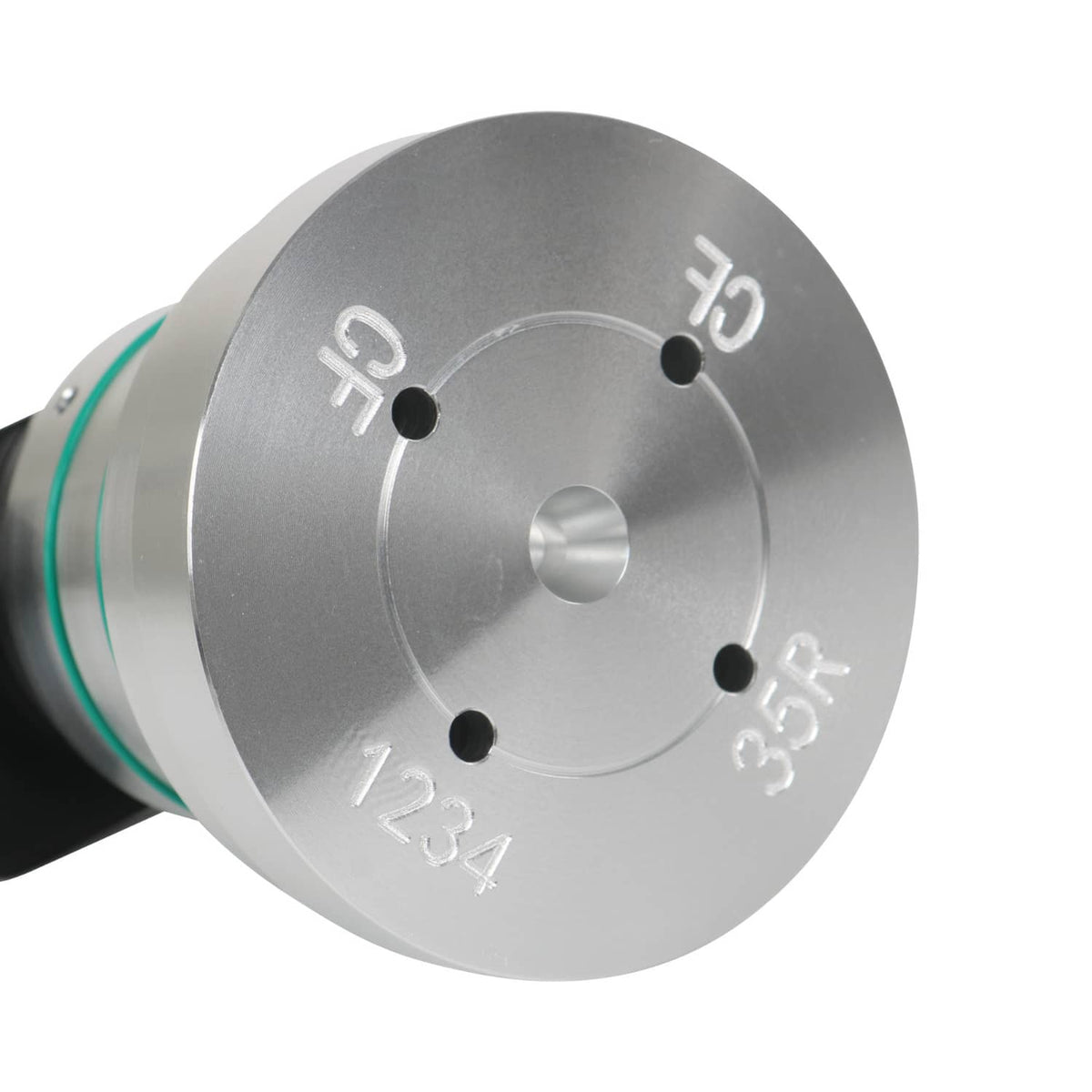 Drum leak tester disk with stamped marks and four black test ports