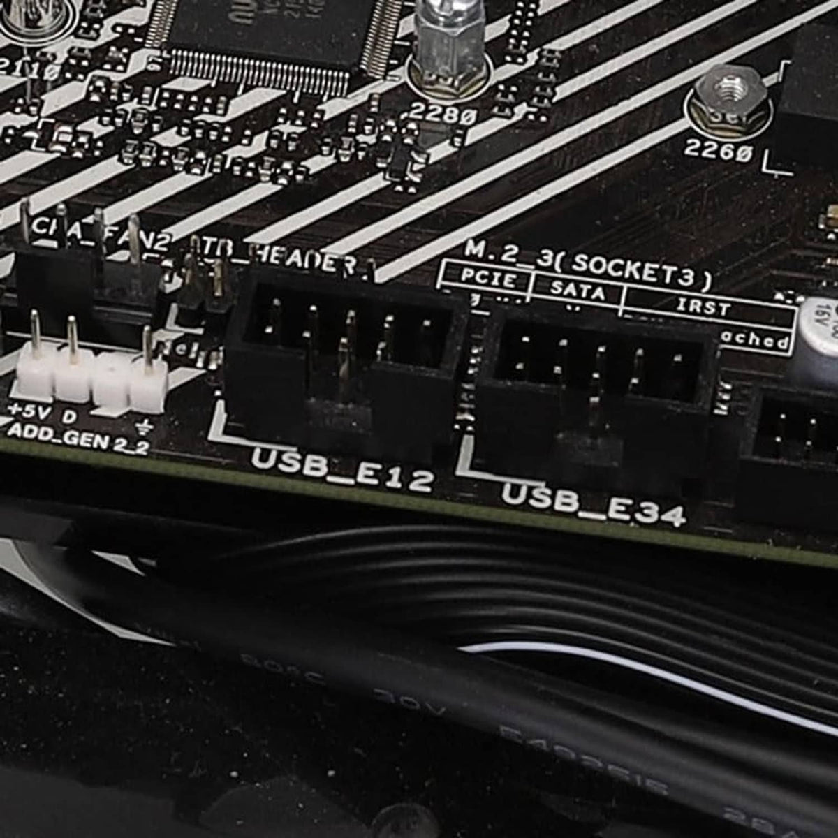 USB 9-pin header splitter cable connectors installed on motherboard USB headers