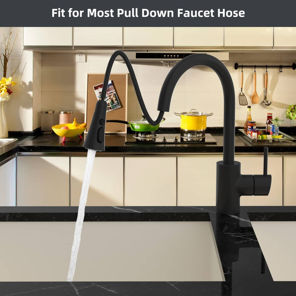 Matte black kitchen faucet head replacement spraying water from a pull-down hose