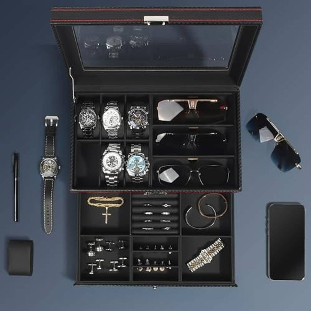 Open black jewelry organizer box with clear lid, watch slots, and ring tray