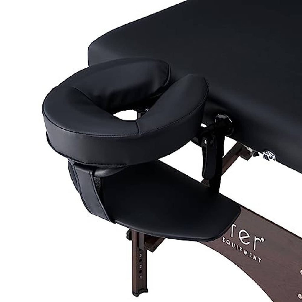 U-shaped black face pillow and adjustable arm support on a massage table