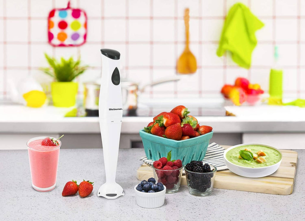 White immersion blender with black button standing upright on countertop