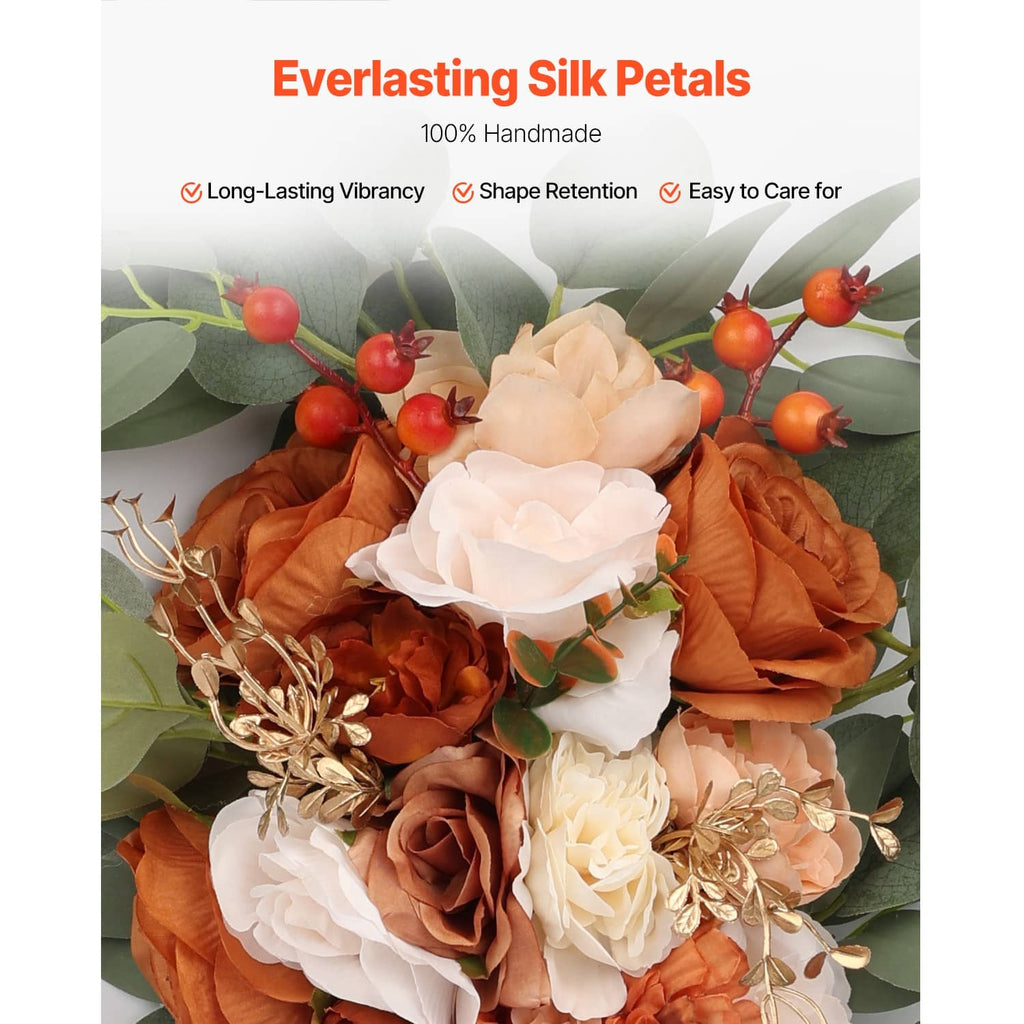 Artificial silk flower bouquet with orange and white petals and green leaves