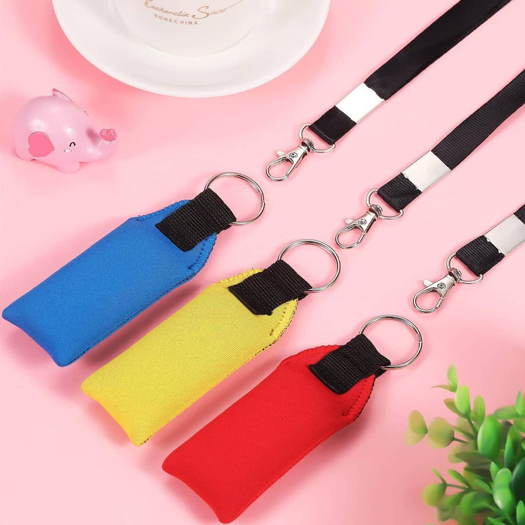 Three neoprene keychains with black lanyards and metal key rings in blue, yellow, and red