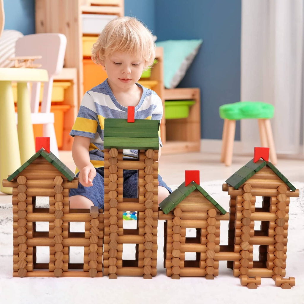 Wooden log building set with log house pieces as a child stacks them