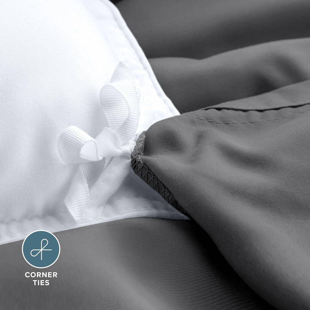 Dark gray duvet cover corner with white corner ties for secure fastening.