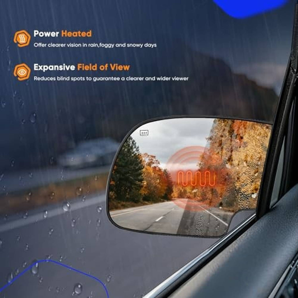 Heated side mirror glass with defrost lines on a rainy road scene