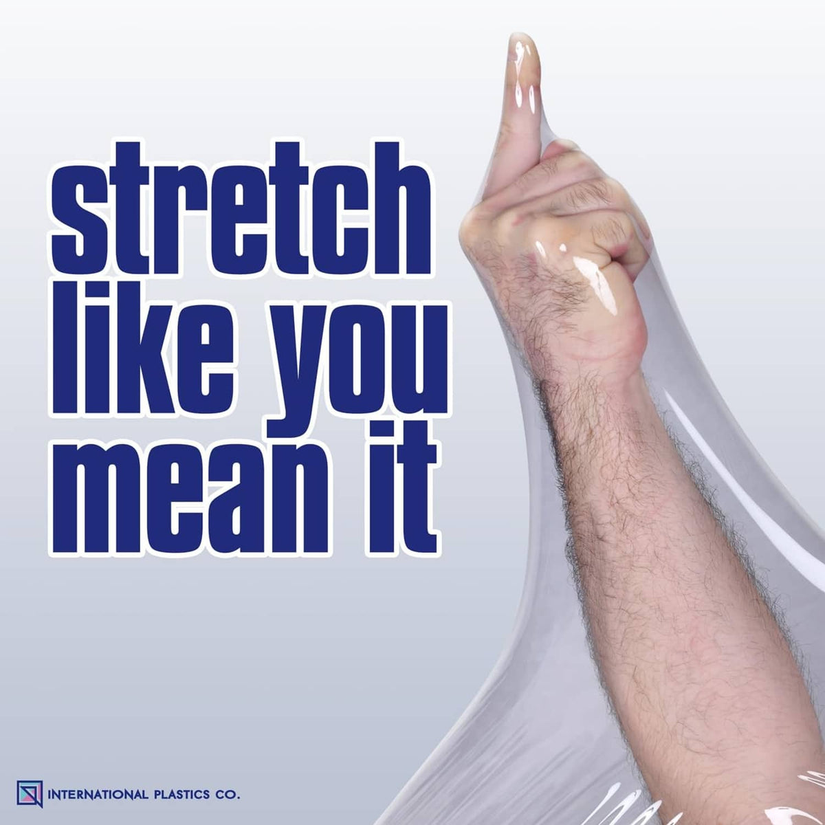 Clear plastic stretch film being pulled from a roll by a hand