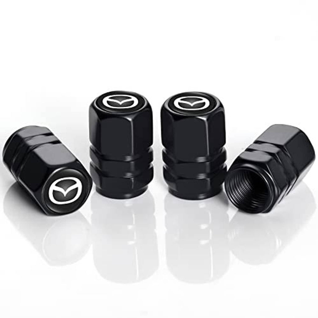 Set of four black metal tire valve stem caps with Mazda emblem, angled front view