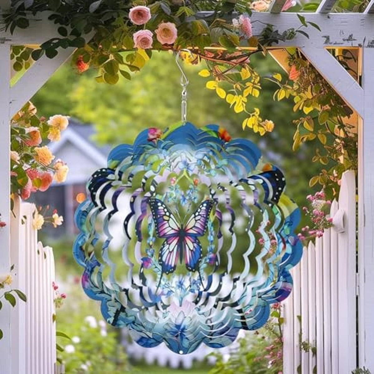 Butterfly wind spinner with blue layered petals, multicolor top accent, and metal hanging hook