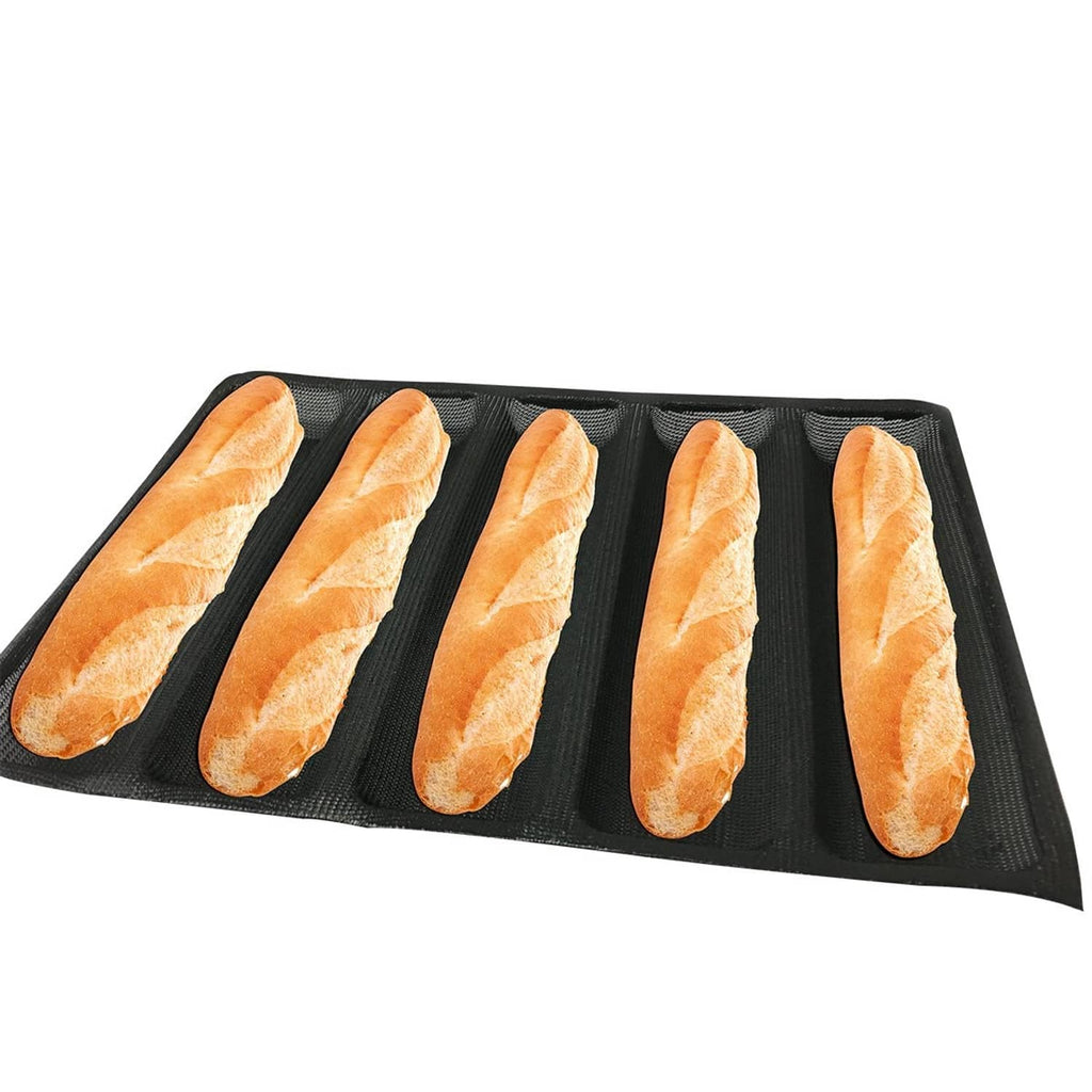 Black silicone hot dog bread mold with 5 dog-shaped cavities, holding baked rolls