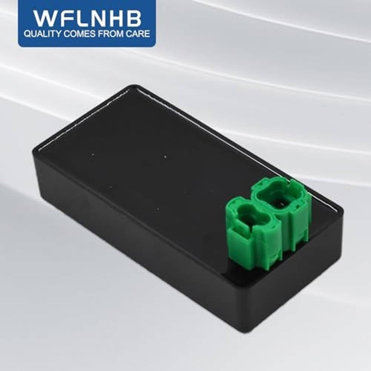 Black CDI module box with green connector terminal block