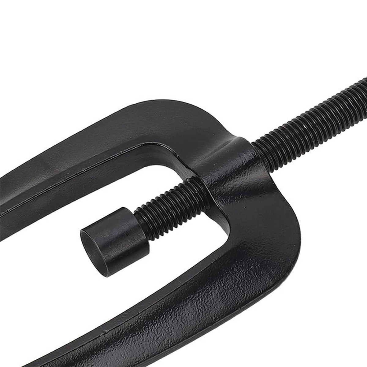 Close-up of black steering support bracket puller jaws and threaded rod connection