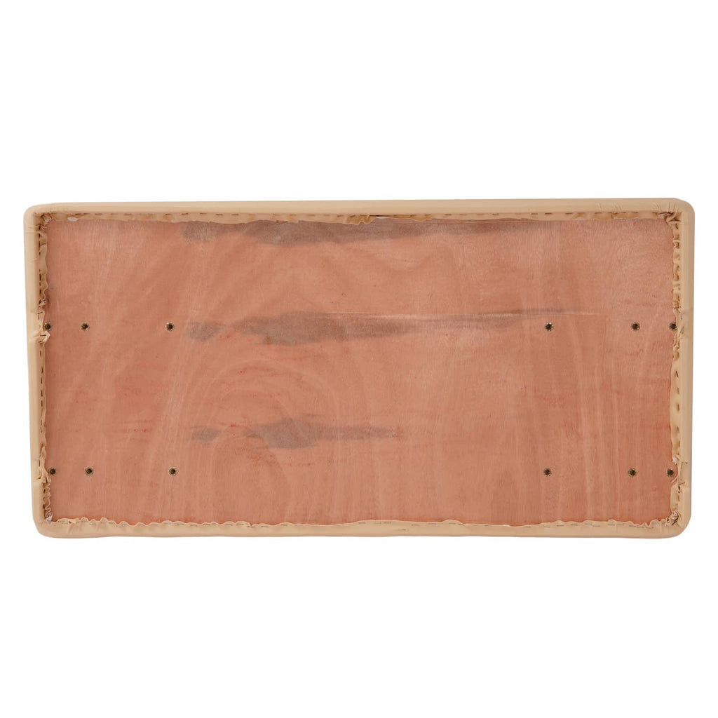 Rectangular underside panel of tan seat bottom with stitched edge and fastener holes
