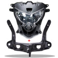 Motorcycle front headlight with black housing and clear lens, with upper stay fairing bracket