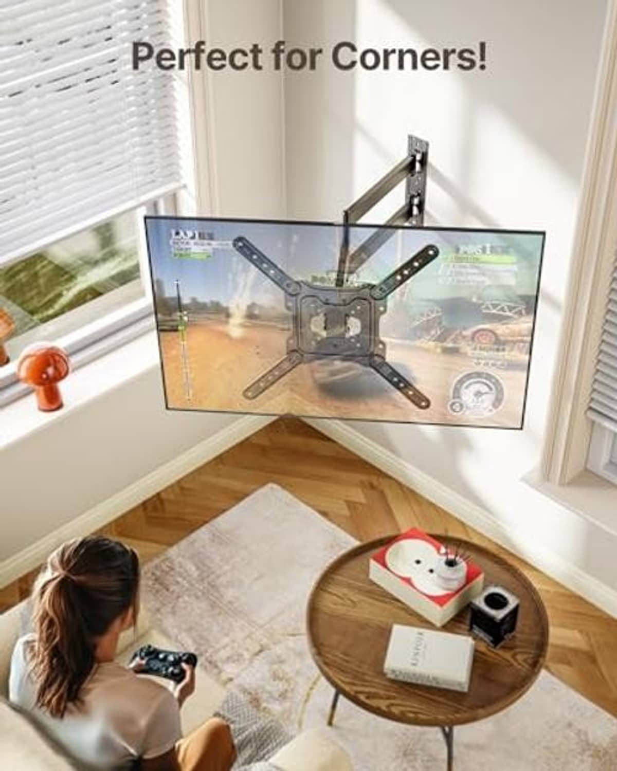 Long arm TV wall mount for a corner, holding a flat-screen TV over a window