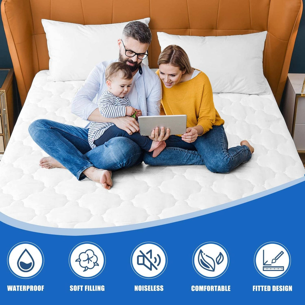 White quilted mattress protector on bed used by family lounging together