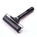 Rubber brayer roller with black handle and metal frame, for printmaking and gluing