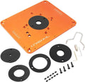 Orange aluminum router table insert plate with central opening, black rings, screws and tools