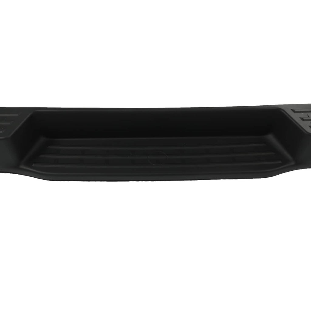 Rear bumper assembly close-up of black grille channel and textured insert