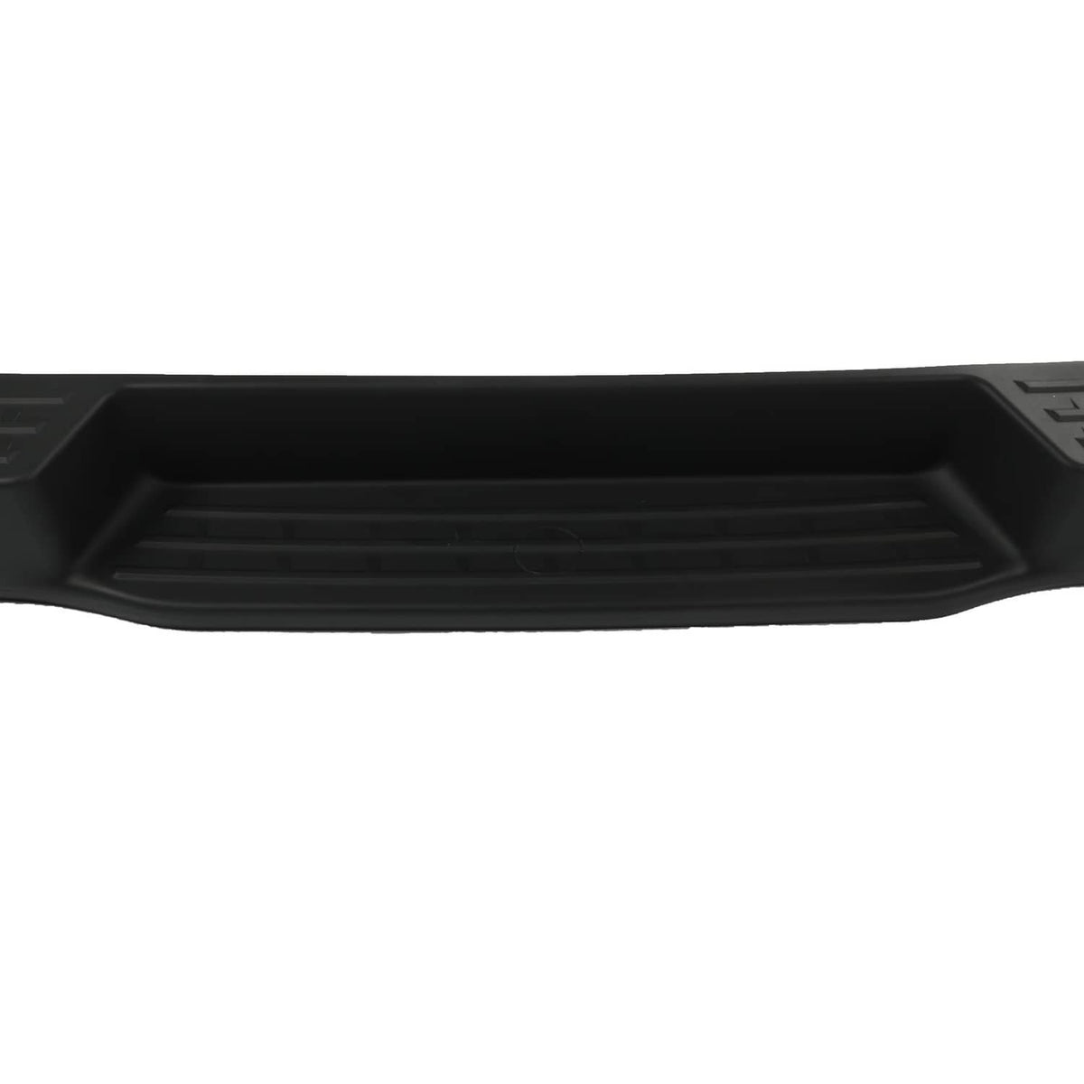 Rear bumper assembly close-up of black grille channel and textured insert