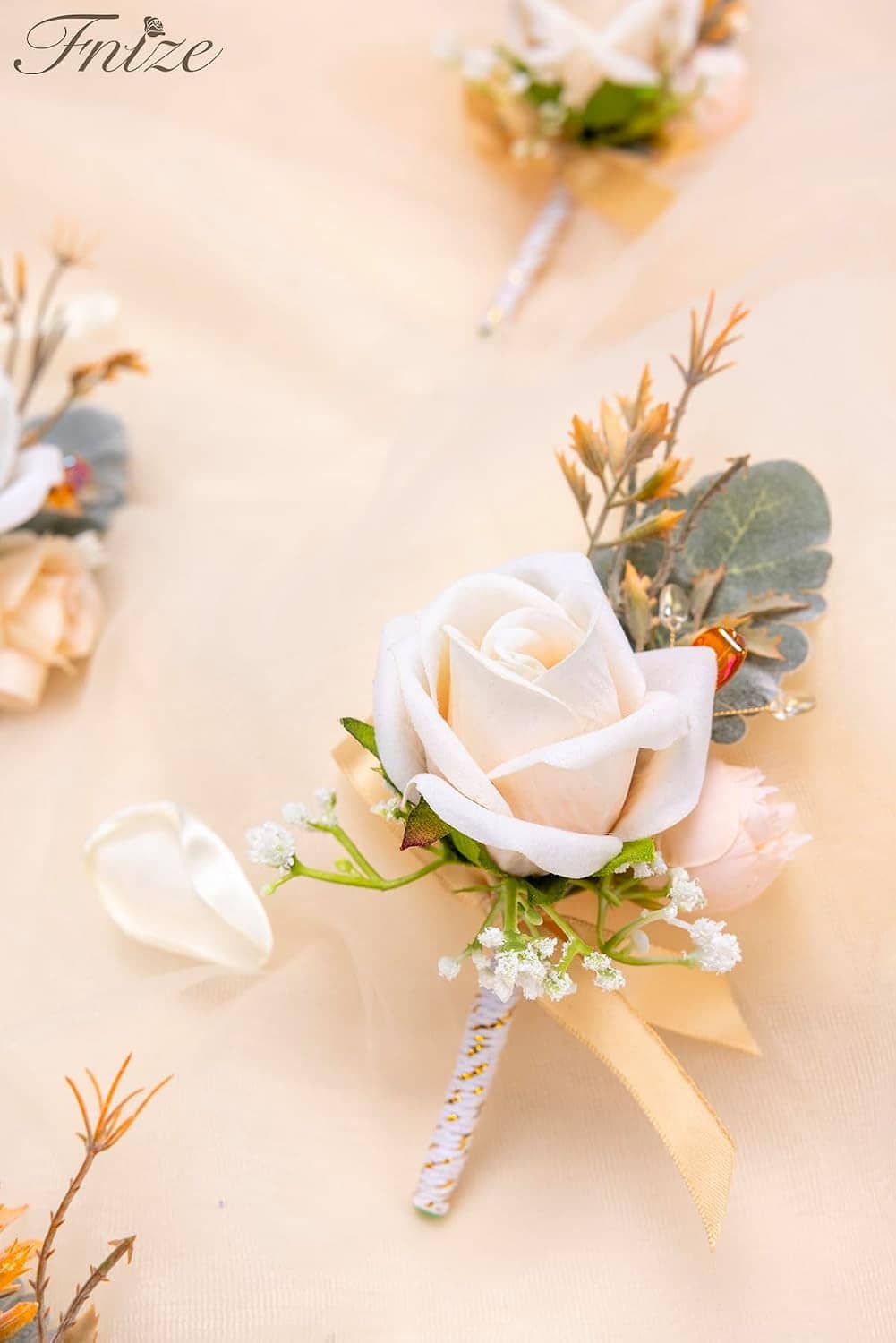 White rose boutonniere with greenery, champagne ribbon and striped twine stem